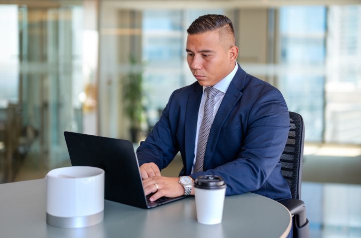 BlackPoint Capital Partners advisor working on client strategy in a bright, modern office
