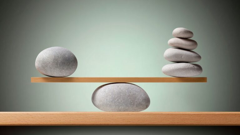 A balanced arrangement of smooth stones symbolizing portfolio rebalancing and asset alignment