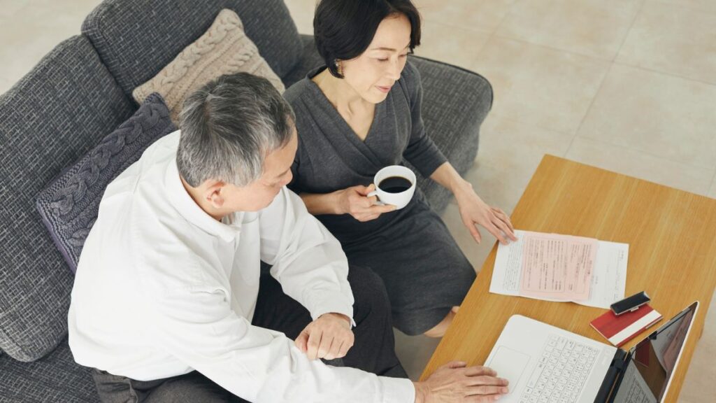 Yes — this one works very well. Here’s why: ✅ The couple looks like your actual demographic — professional, thoughtful, and mature. ✅ The neutral tones and setting (laptop, documents, coffee) fit your brand’s calm, credible aesthetic. ✅ It subtly conveys reviewing financial information or planning together without looking staged or exaggerated. Perfect for a post about cross-border coordination, wealth transfer, or financial communication. Use this: File Name (FN): blackpoint-global-wealth-discussion.jpg Alt Text (AT): Mature couple reviewing international financial documents and retirement plans on a laptop at home.