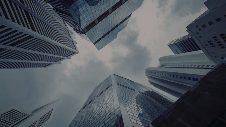 Modern financial district buildings representing global markets and economic structure