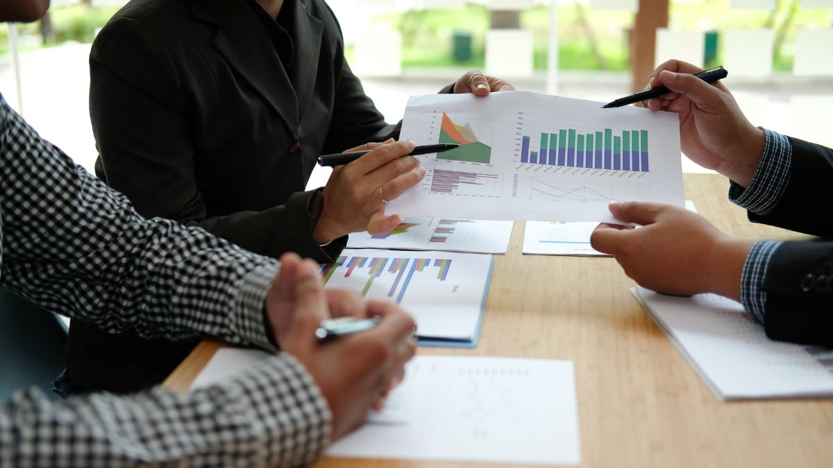 Financial professionals reviewing documents and discussing strategy