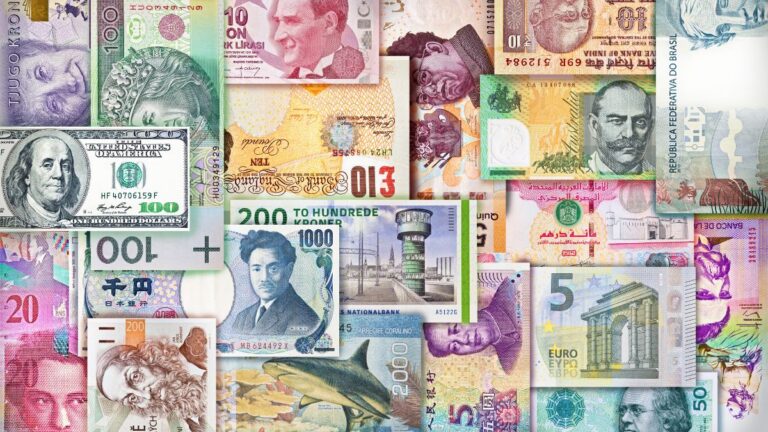 Global currencies including GBP and USD illustrating foreign exchange and currency risk