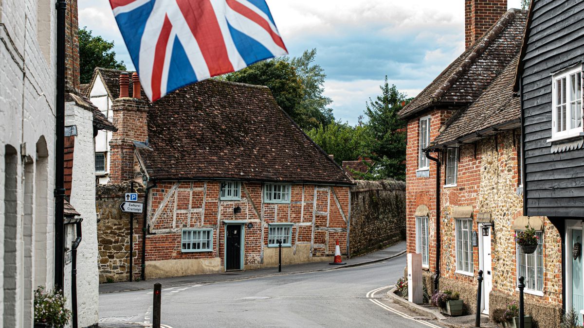Traditional UK village street representing relocation back to the UK from the US