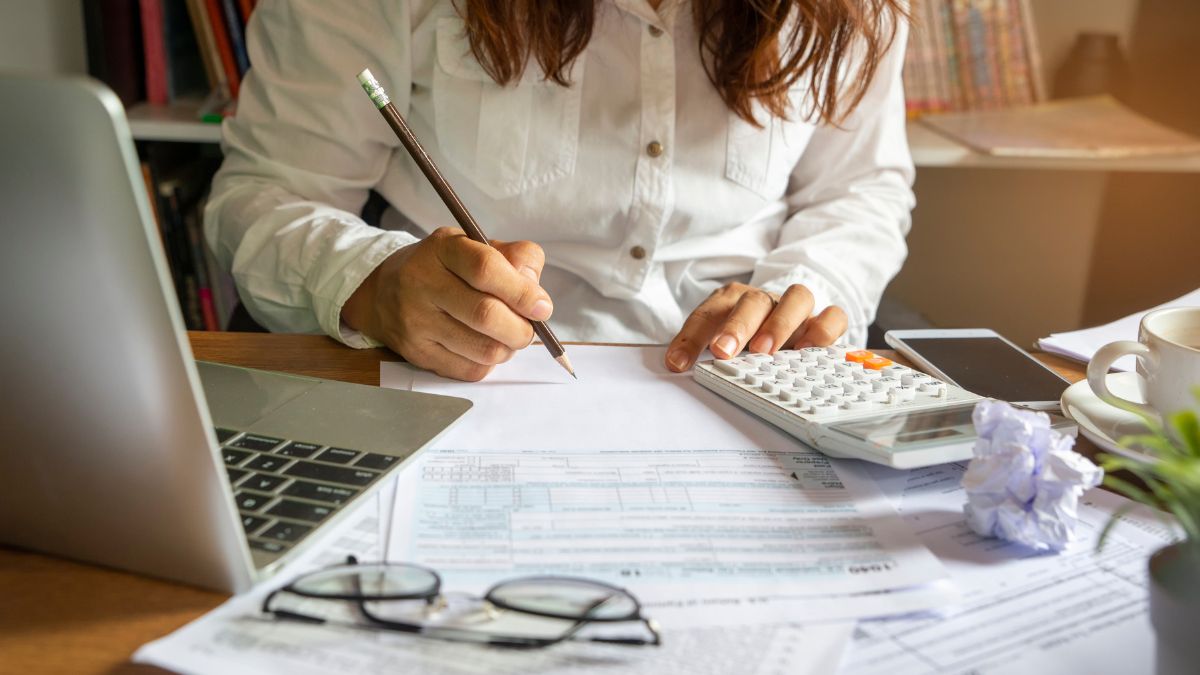 Individual reviewing financial documents illustrating tax planning and preparation